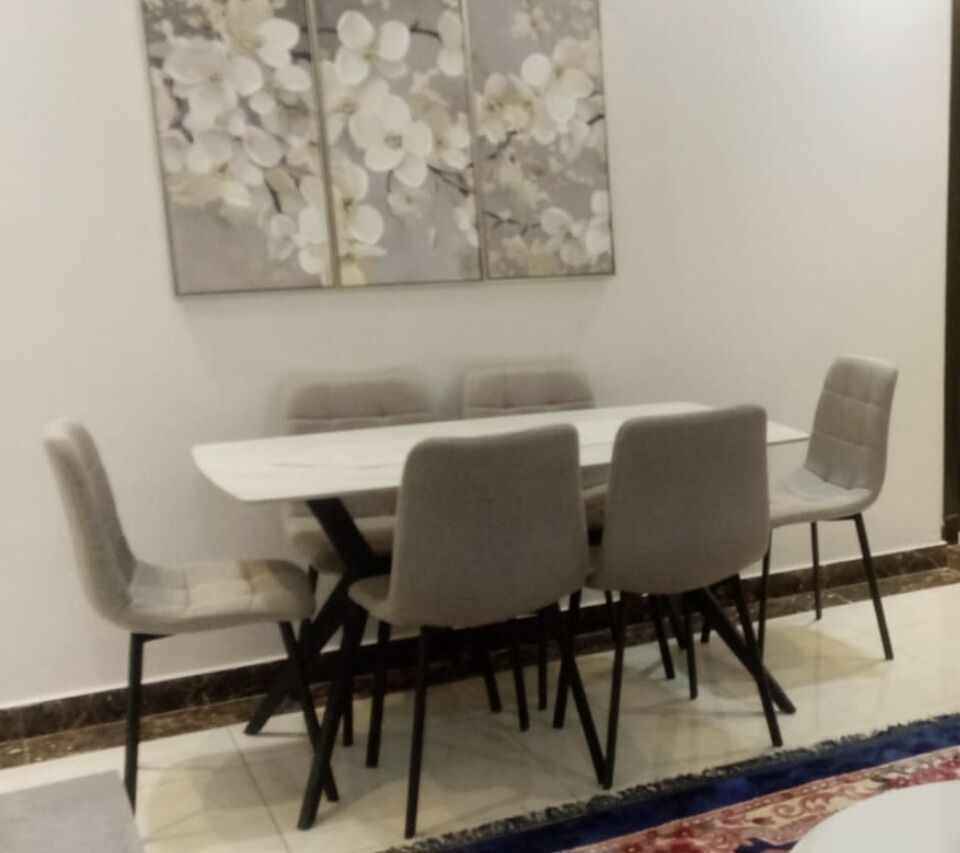 SAR 750 – Almost New Elegant 6-Seater Sintered Stone Dining Table Set