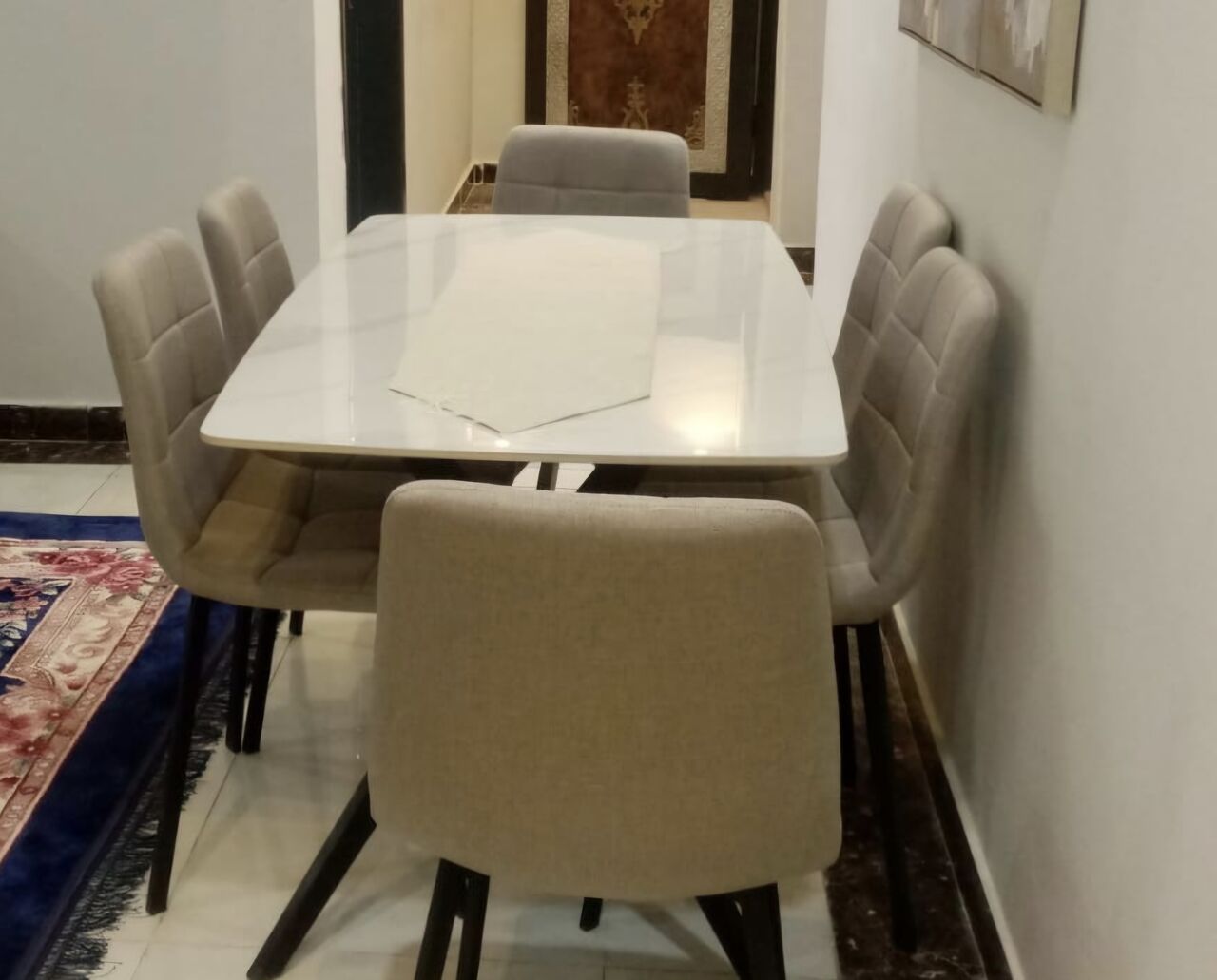 SAR 750 – Almost New Elegant 6-Seater Sintered Stone Dining Table Set